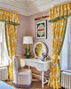 Dressing room interior featuring Peonies Printed Fabric in Lemon as curtains, contrasted with pink patterned wallpaper. The space is feminine, colourful, and eclectic. Photography by Simon Brown.